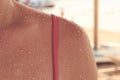 texture and water droplets on the girl body, pink swimsuit