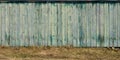 The texture of weathered wooden wall. Aged wooden plank fence of vertical flat board