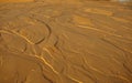 The texture of wet sea sand with patterns water Royalty Free Stock Photo