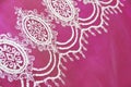 Texture of white decorative lace fabric with floral ornament on pink background Royalty Free Stock Photo