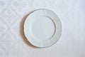 The texture on the white fabric. a linear pattern. White plate. tableware Royalty Free Stock Photo