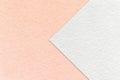 Texture of white and pink paper background, half two colors with arrow, macro. Structure of dense craft coral cardboard Royalty Free Stock Photo