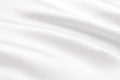 Texture of white satin or silk fabric with waves and rumples. white material