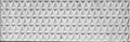 Texture of a wide decorative concrete wall panel with geometric pattern in the form of embossed triangles Royalty Free Stock Photo