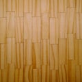 the texture of the wood bars is laid out in a geometric shape with repeating rhythms.