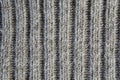 Texture ofo woolen knitwear with large pattern `elastic band`, gray, vertical line, , close-up.