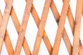 Texture of the wooden lattice isolated on white background. Natural wooden diagonal lattice Royalty Free Stock Photo