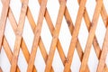 Texture of the wooden lattice isolated on white background. Natural wooden diagonal lattice Royalty Free Stock Photo