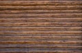 Texture of a wooden log wall. Old planed logs Royalty Free Stock Photo