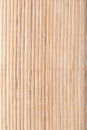 Texture of wooden mat. Asian style straw weave rug. Background bamboo sticks with thread uniting Royalty Free Stock Photo