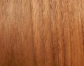 Texture of a wooden surface of an American walnut tree. Wood veneer for furnitur Royalty Free Stock Photo