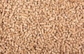 Texture of woody clumps, pellets of litter, for cat, rabbit, guinea pig, hamster, rodent, bird Royalty Free Stock Photo