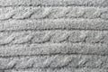 Texture wool, knitted material witha pattern `pigtail`, drai,  close-up. Royalty Free Stock Photo