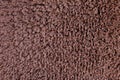 Texture of woolen brown wet carpet