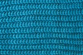 Texture of woolen knitted scarf. Yarn with knitting. Ornament of a blue knitted sweater. Abstract textile background. Royalty Free Stock Photo