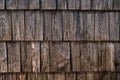 Texture of worn wooden roof tile pattern, detail of a typical old slovenian alpine cottage roofing Royalty Free Stock Photo