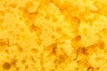 Texture worn yellow sponge for washing dishes , close-up abstract background Royalty Free Stock Photo
