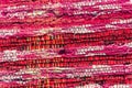 Texture of woven cotton red, pink, white threads Royalty Free Stock Photo