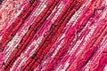 Texture of woven cotton red, pink, white threads Royalty Free Stock Photo