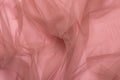 Texture of wrinkled, crumpled pink tulle fabric close-up. background for your mockup Royalty Free Stock Photo