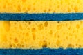 Texture yellow foam rubber, synthetic sponge with large pores, close-up background Royalty Free Stock Photo