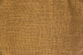 Textured, aged jute fabric. Texture of the old beige fabric. Royalty Free Stock Photo