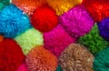 Textured background of assorted and multicolored wool pom poms Royalty Free Stock Photo