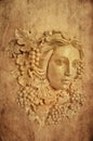 Textured Background of Grape haired Greek woman sconce statue