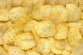 Textured background of natural corrugated potato chips