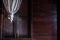 Textured background: Wooden pattern of Window and White lace curtains in traditional thai house Royalty Free Stock Photo