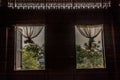 Textured background: Wooden pattern of Window and White lace curtains in traditional thai house Royalty Free Stock Photo