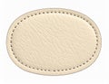 Textured Beige Oval Leather Patch with Stitched Border on White Background cream Royalty Free Stock Photo