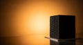 Textured black monolith against warm orange light Royalty Free Stock Photo