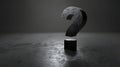 Textured black question mark on a dark, grungy surface with subtle lighting, mystery, unknown Royalty Free Stock Photo