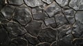 Textured black stone wall with irregular geometric shapes Royalty Free Stock Photo