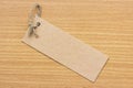 Textured blank tag tied with brown string. Price tag Royalty Free Stock Photo