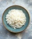 Cooked white rice served in a textured blue bowl for a meal Royalty Free Stock Photo