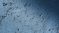 Textured Blue Concrete Wall Surface with Deep Cracks and Dramatic Shadow Lighting Royalty Free Stock Photo