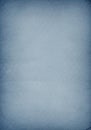 A textured blue paper background with a subtle gradient, transitioning from darker at th Royalty Free Stock Photo