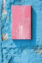 A textured blue wall featuring a contrasting pink rectangular paint stroke, perfect for adding custom text or messages