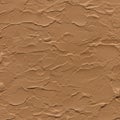 Textured brown surface with irregular, raised patterns resembling cracked earth or Royalty Free Stock Photo