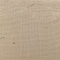 A textured burlap fabric background with natural fibers and a rustic look