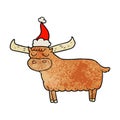 textured cartoon of a bull wearing santa hat