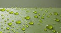 Textured chartreuse surface with droplets creating an embossed design