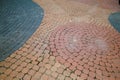 Textured Cobblestone Pavement with Circular Patterns in Contrasting Colors Royalty Free Stock Photo