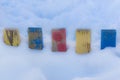 Textured Colorful Painted Blue, Red, Yellow Wooden Picket Fence Planks In Deep Snow, Colorful Rustic Style Background For Vintage Royalty Free Stock Photo