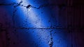 Textured concrete wall illuminated by dramatic blue and pink light Royalty Free Stock Photo