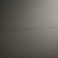 Textured concrete wall with visible horizontal lines and small cracks. The surface Royalty Free Stock Photo