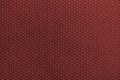 Textured corrugated background of scarlet coral color