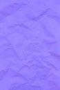 Textured crumpled purple paper background. Copyspace